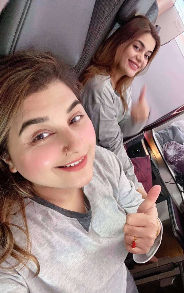 Javeria Saud having fun on the plane with her friend