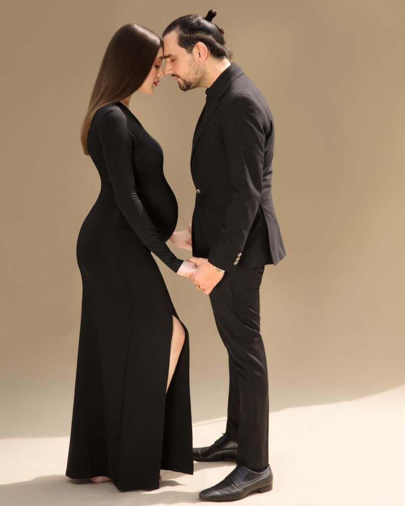 Pregnant Neha Rajpoot and Shahbaz Taseer Share an Embrace in BLACK GOWN Maternity Photoshoot